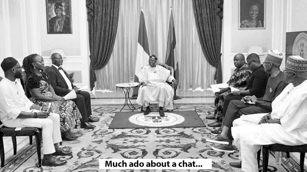 presidential media chat with tinubu and journalists seated in a room in a U-shaped seating arrangement, with the president in the middle